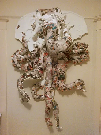 The elephant-octopus half built, still in bare newspaper