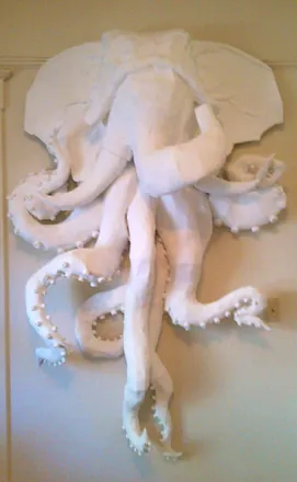 The elephant-octopus in white on a pale wall